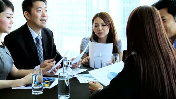 Asian business team in boardroom — Stock Video