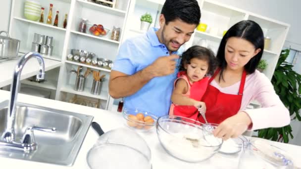 Girl with parents making cookie — Stock Video