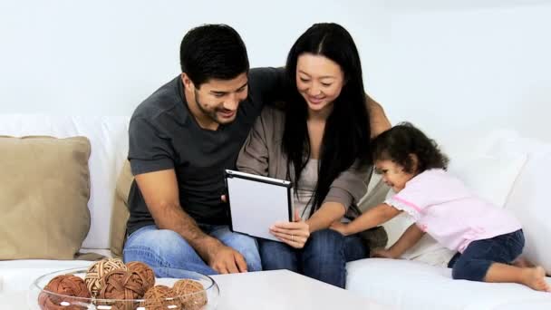 Parents with daughter using tablet — Stock Video