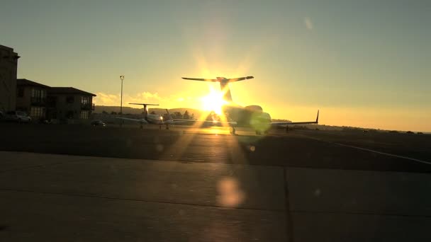 California airport runway with plane at sunset — Stock Video