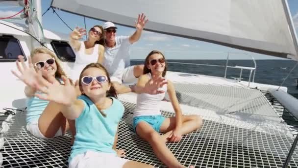 Mother and father with smiling girls  on yacht — Stock Video