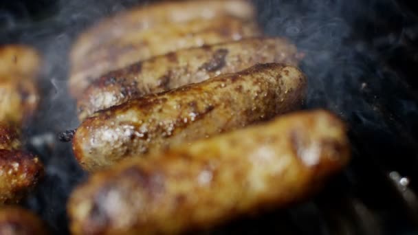 Sausages grilling chargrilled barbecue — Stock Video