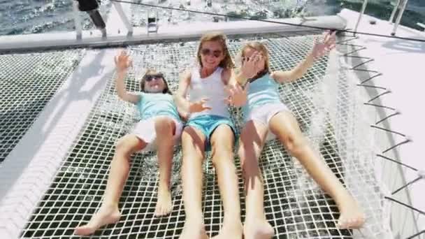 Young sisters having fun on luxury yacht — Αρχείο Βίντεο