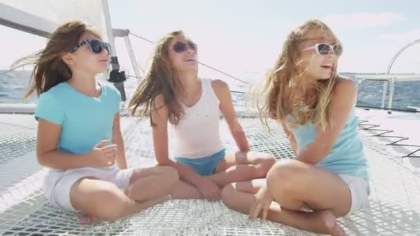 Young sisters having fun on luxury yacht — Stockvideo