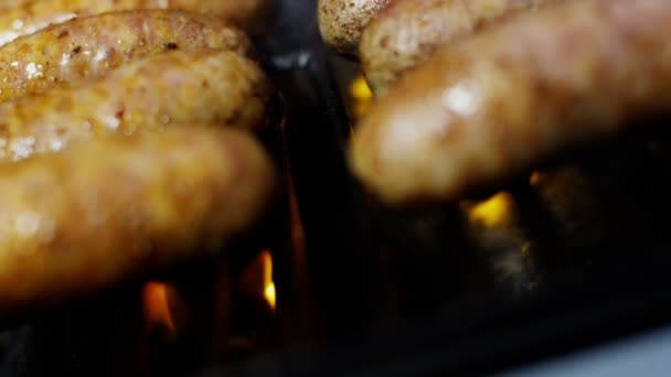 Sausages grilling chargrilled barbecue — Stock Video