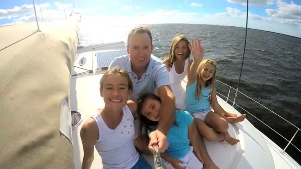 Parents with daughters having fun on yacht — Stock Video