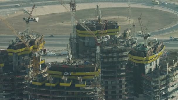 Aerial construction cranes high Dubai development — Stock Video