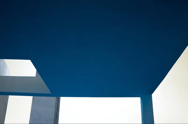 Concrete structures above blue sky — Stock Photo, Image