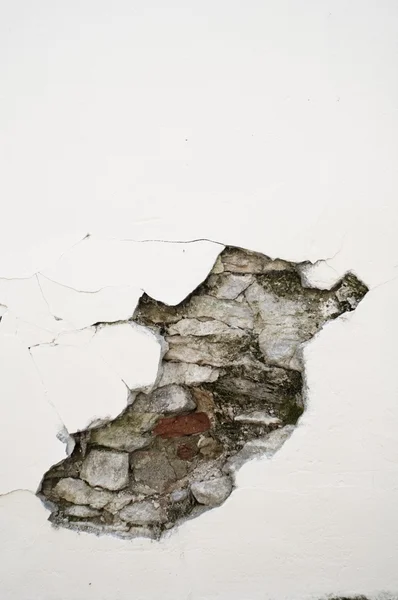 Cracked wall with bricks — Stok fotoğraf