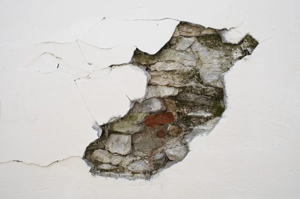 Cracked wall with bricks — Stok fotoğraf