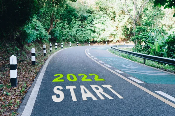 Start line to 2022 on road in wood the beginning of a journey to the destination in business planning, strategy and challenge or career path, opportunity concept.