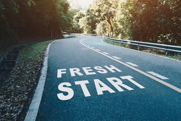 Fresh start on road lane in wood  represents the beginning of a journey to the destination in business planning, strategy and challenge or career path, opportunity concept.