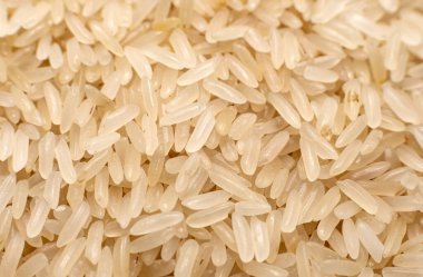 Ri. Tahıllar. Yakın planda çiğ pirinç taneleri. Sağlıklı ve dengeli beslenme