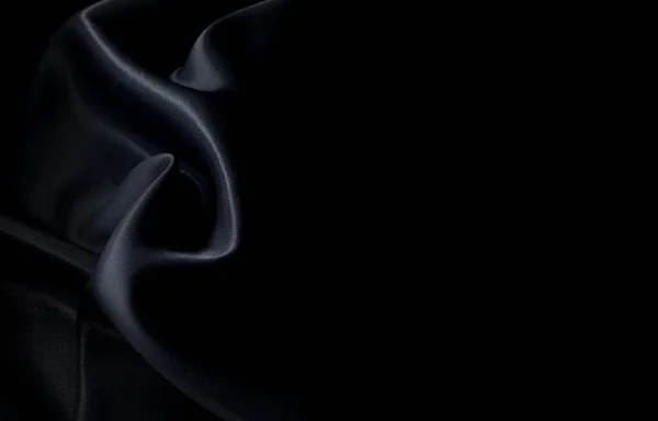 Sanat eserlerinin arka planı ve dekorasyonu için kumaşın koyu kumaş dokusunun bir parçası, güzel buruşmuş ipek ya da keten deseni. Buruşuk bir kumaş parçası.