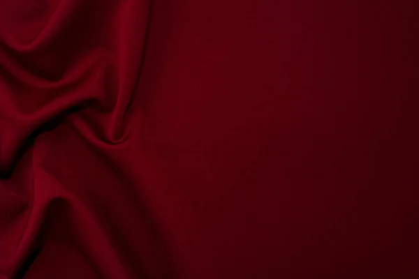 Sanat eserlerinin arka planı ve dekorasyonu için kumaşın koyu kumaş dokusunun bir parçası, güzel buruşmuş ipek ya da keten deseni. Buruşuk bir kumaş parçası.