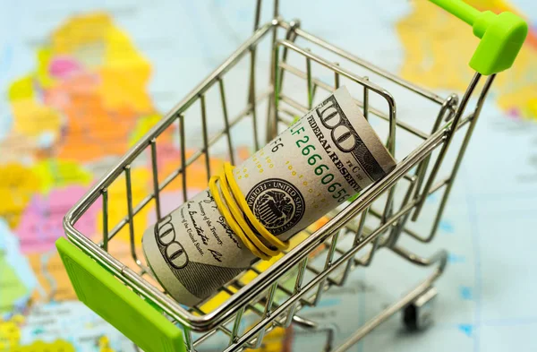 Shopping Cart Money Geographical Map Money Dollar Purchases Trade Shopping Royalty Free Stock Images