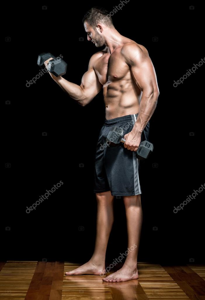 Man doing biceps curls in — Stock Photo © ozimicians #53317699