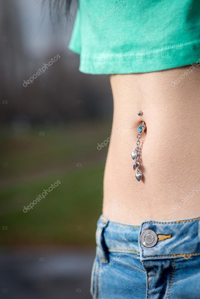 Navel piercing close up Stock Photo by ©ozimicians 65115457