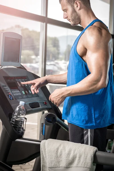 Man setting treadmill — Stock Photo, Image