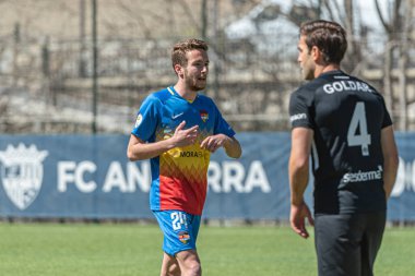 Encamp, Andorra: 2021 Nisan 04: M. Aguado FCA, 4 Nisan 2021 tarihinde Andorra, Andorra 'daki Prada de Moles Stadyumu' nda FC Andorra ve Ibiza arasında oynanan İkinci Lig B maçında oynamaktadır.