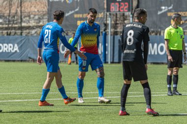 Encamp, Andorra: 2021 Nisan 04: Carlitos FCA, 4 Nisan 2021 tarihinde Andorra, Andorra 'daki Prada de Moles Stadyumu' nda FC Andorra ve Ibiza arasında oynanan İkinci Lig B maçında oynamaktadır.