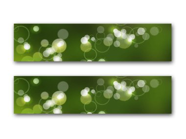 Bokeh, ışıklar ve daireli yeşil pankartlar.