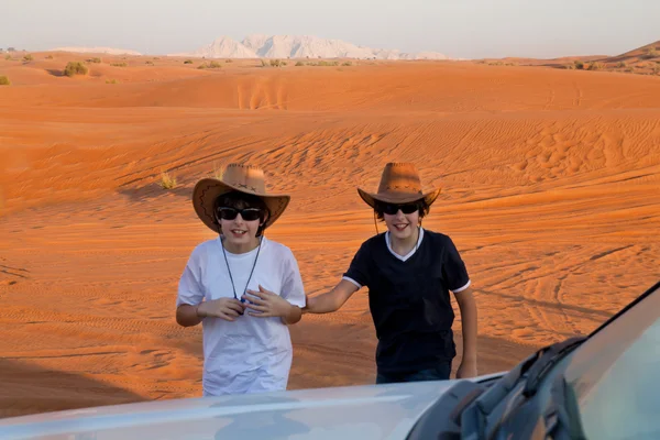 Happy boys in a desert — Stock Photo, Image