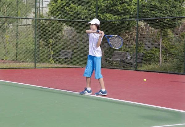 The boy is playing tennis — Stock Fotó