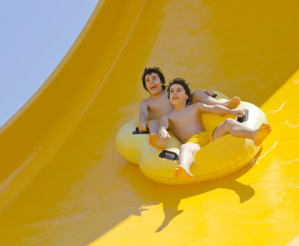 The  boys are have fun in the water park — Zdjęcie stockowe