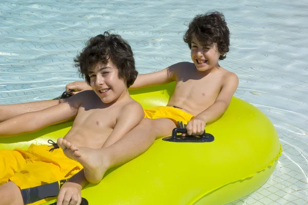 The  boys are have fun in the water park — Stockfoto