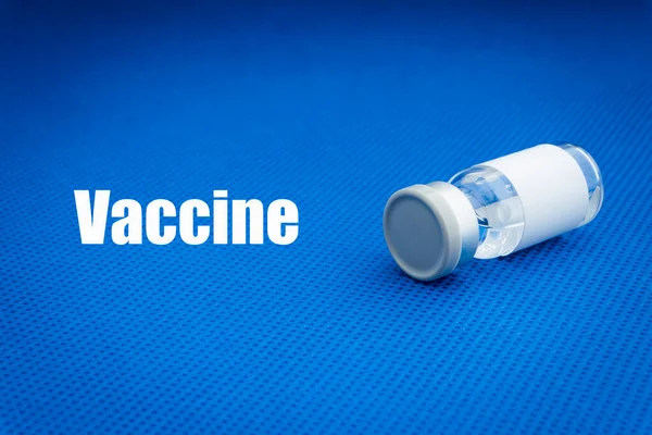 Vaccine Texte Avec Flacon Sur Fond Bleu Concept Vaccination Coronavirus Images De Stock Libres De Droits