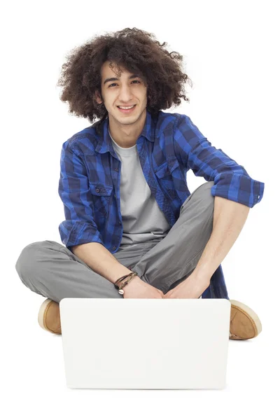 Young man working on laptop — Stock Photo, Image