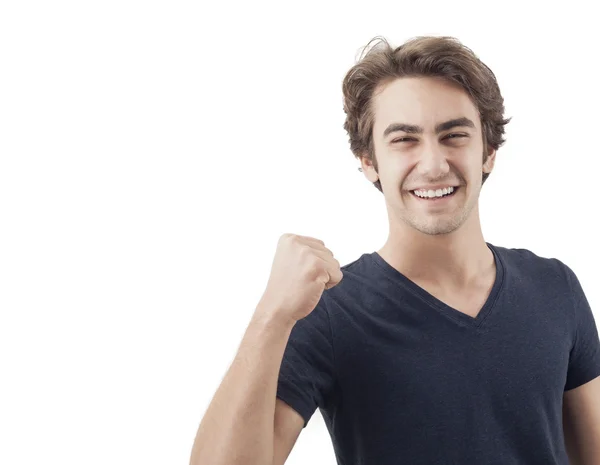 Portrait of a young man with his fist raised — Stock Photo, Image