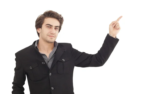 Handsome young man pointing to somewhere — Stock Photo, Image