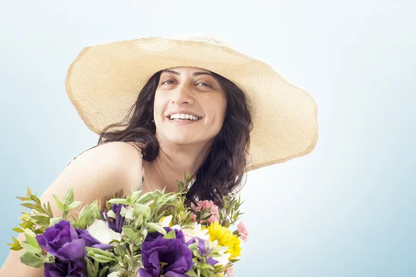 Woman holding flower bouquet — Stock Photo, Image