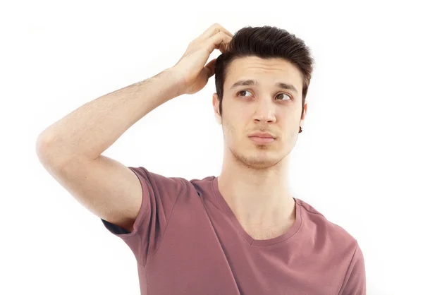 Young man scratching her head — Stock Photo, Image