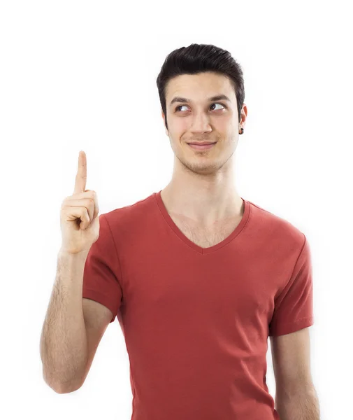 Smiling young man pointing up — Stock Photo, Image