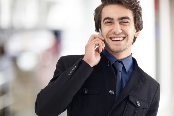 Young man talking mobile phone — Stock Photo, Image