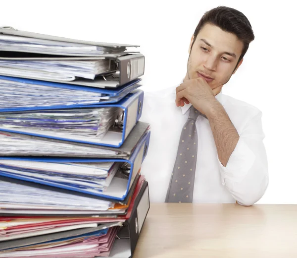 Worried businessman with folders — Stockfoto