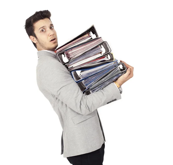 Empresário transportando pilha de pastas de arquivos — Fotografia de Stock
