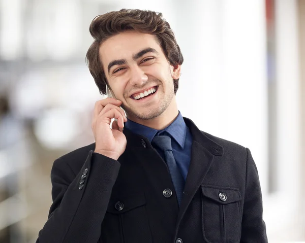 Young man talking mobile phone — Stock Photo, Image