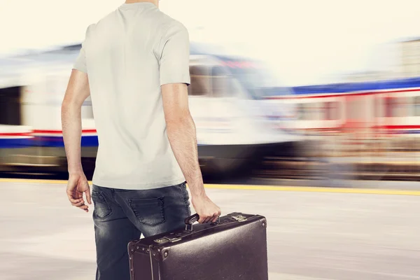 Young traveler on train station — Stock Photo, Image