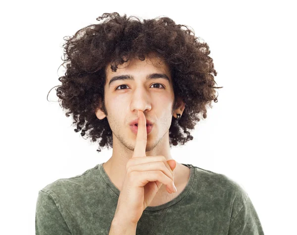 Young man making silence gesture — Stock Photo, Image