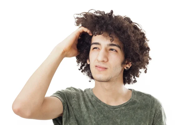 Joven rascándose la cabeza — Foto de Stock