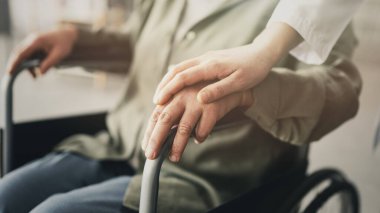 Elderly patient who has difficulty walking and uses a wheelchair