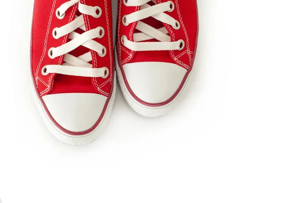 Взуття на червоному полотні на білому тлі — стокове фото