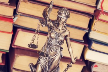 Law concept, statue of justice and books clipart