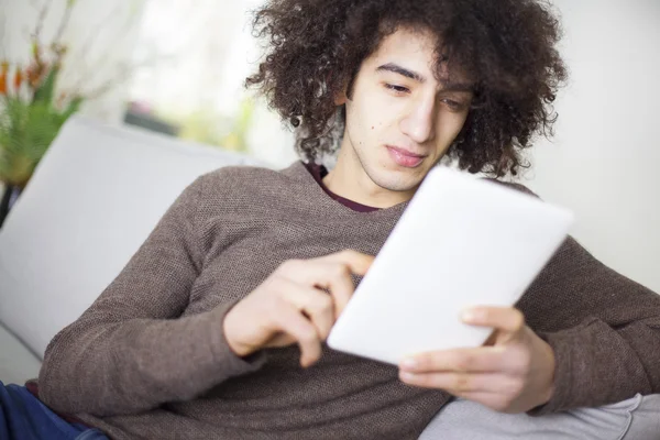 Young man using digital tablet — Stock Photo, Image