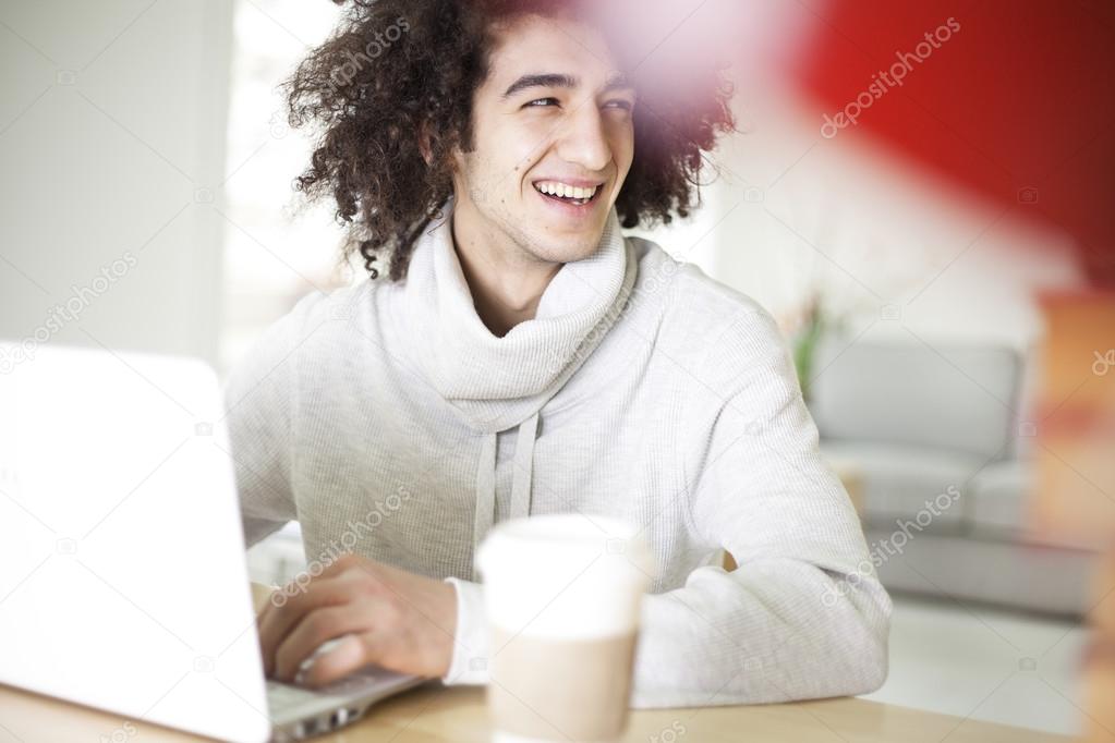 Portrait of young man using computer