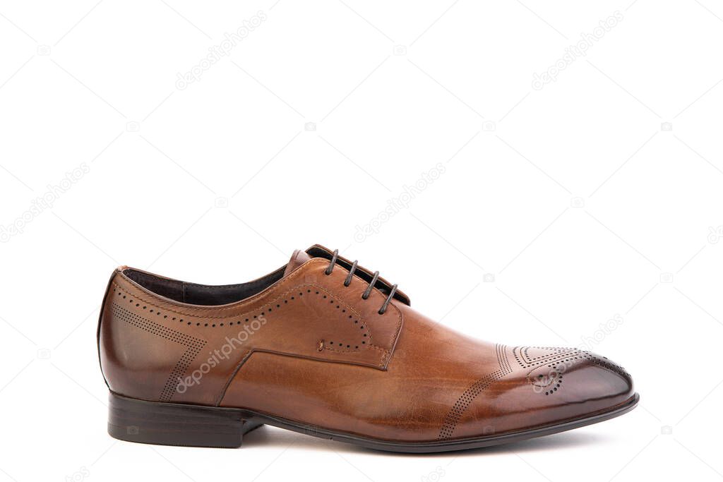 A classic leather elegant brogues men's shoes isolated white background. Groom's stylish brown shoes. Isolated object close up on white background. Right shoe view.